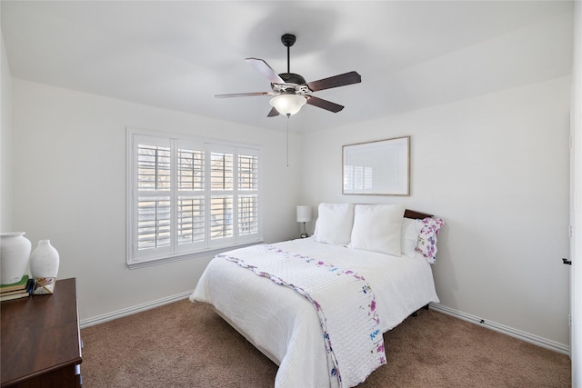 carpeted bedroom featuring a ceiling fan and baseboards