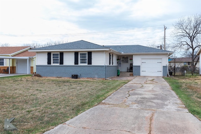 single story home with a garage, driveway, a front yard, and brick siding