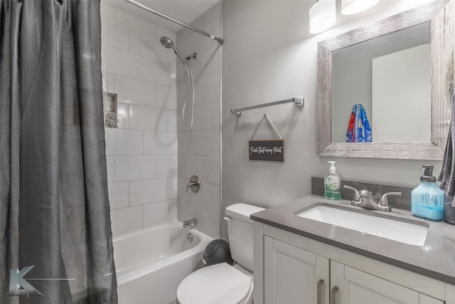 bathroom featuring toilet, shower / tub combo with curtain, and vanity