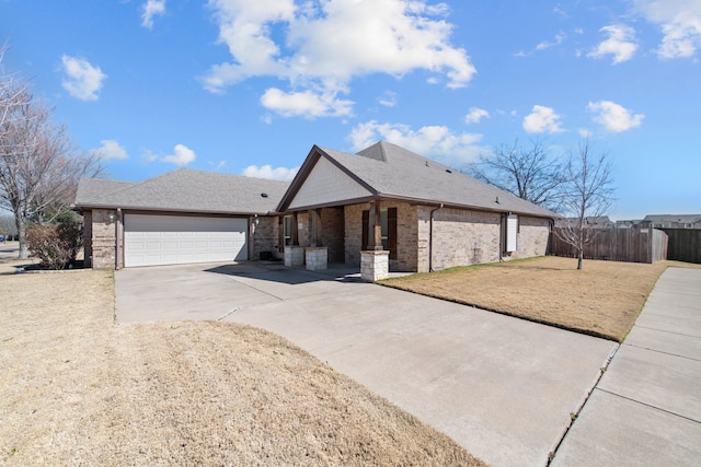 single story home featuring driveway, roof with shingles, an attached garage, fence, and brick siding