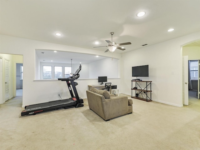 workout room with visible vents, arched walkways, baseboards, light colored carpet, and recessed lighting