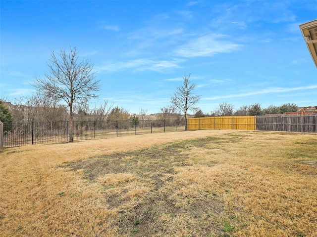 view of yard with a fenced backyard