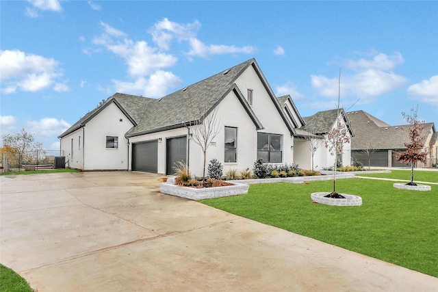 view of front facade featuring stucco siding, a shingled roof, concrete driveway, a front yard, and a garage