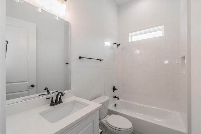 bathroom with vanity, bathtub / shower combination, and toilet