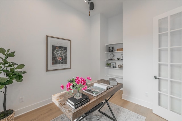 office featuring light wood finished floors and baseboards