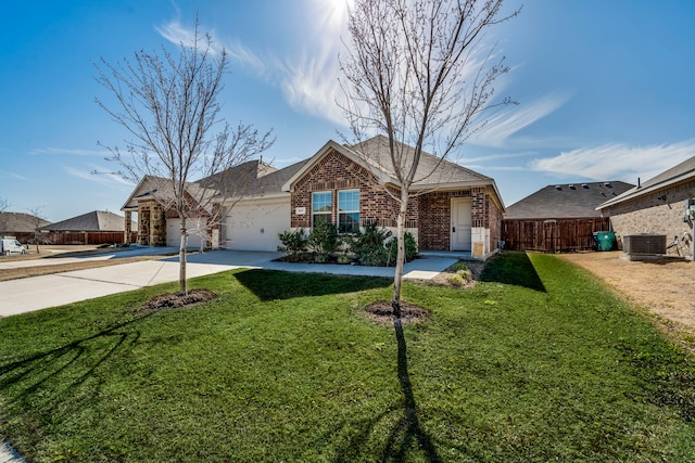 ranch-style house featuring driveway, brick siding, a front yard, and fence