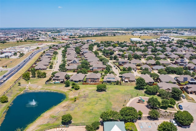 bird's eye view with a residential view and a water view