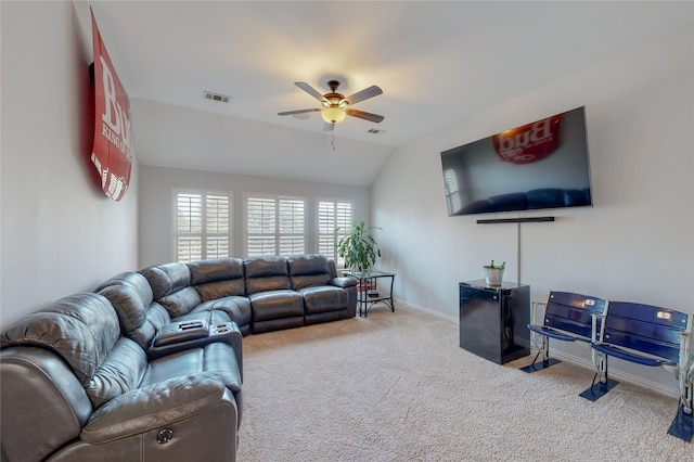 carpeted living room featuring vaulted ceiling, visible vents, a ceiling fan, and baseboards