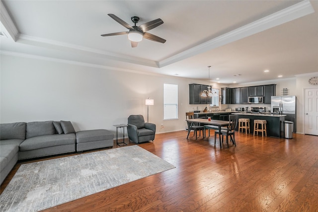 537 Running Water Trl, Fort Worth, TX 76131 - living room with ornamental molding, a tray ceiling, ceiling fan, recessed lighting, and dark wood-type flooring