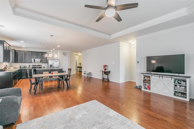 537 Running Water Trl, Fort Worth, TX 76131 - living room with a ceiling fan, recessed lighting, wood finished floors, crown molding, and a chandelier
