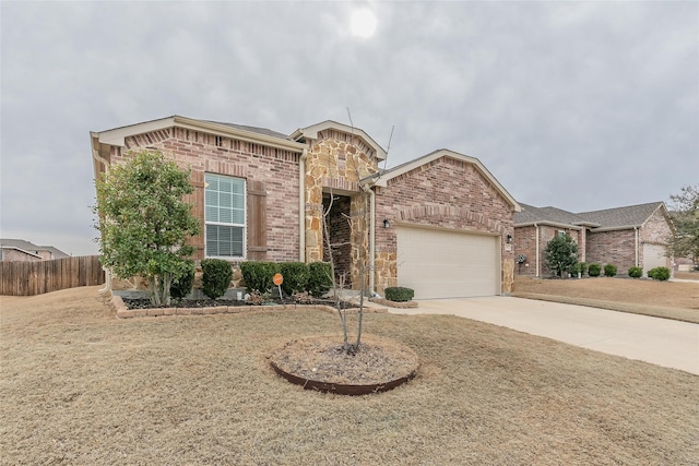 view of front facade with brick siding, fence, a garage, stone siding, and driveway