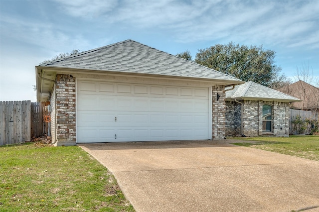 ranch-style home featuring a shingled roof, a front yard, concrete driveway, and fence