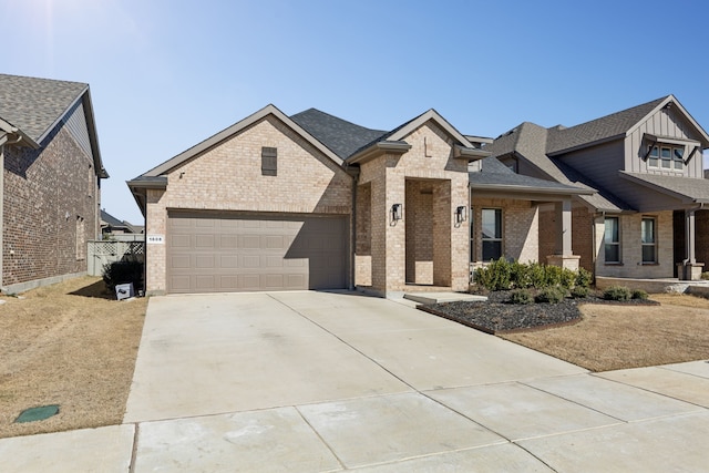 view of front of property with a shingled roof, concrete driveway, brick siding, and a garage