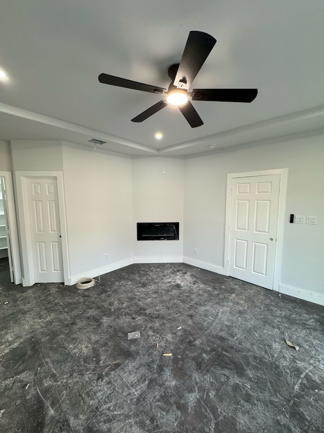 unfurnished living room with visible vents, a fireplace, and baseboards