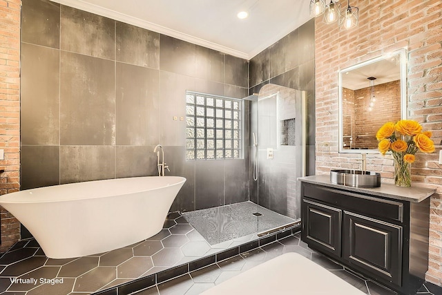 bathroom featuring crown molding, tile walls, a soaking tub, a stall shower, and vanity