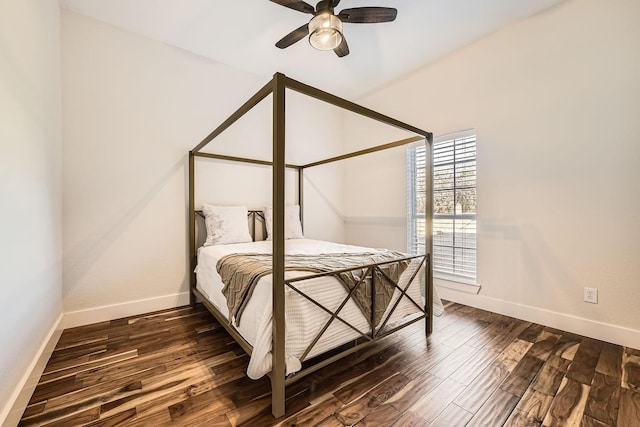 bedroom featuring a ceiling fan, dark wood-style flooring, and baseboards