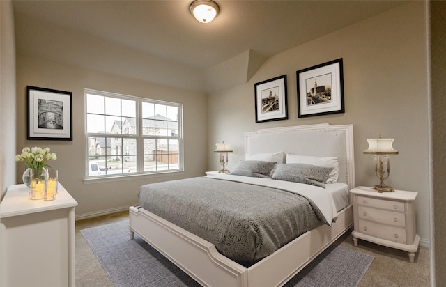 bedroom with carpet floors and baseboards