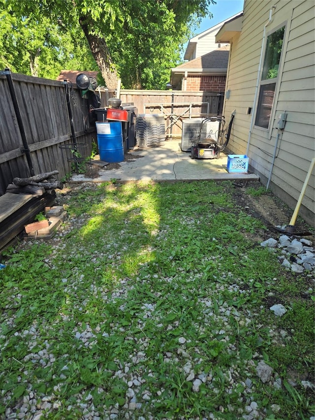 view of yard featuring a patio area and a fenced backyard