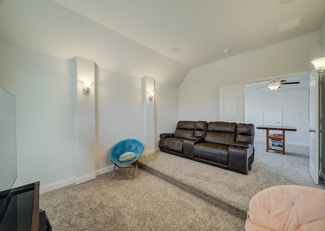 living room featuring vaulted ceiling, carpet flooring, a ceiling fan, and baseboards