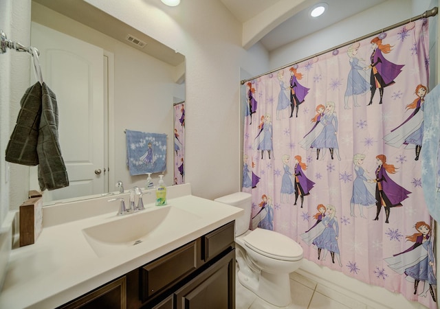 full bath with visible vents, toilet, shower / tub combo, vanity, and tile patterned flooring