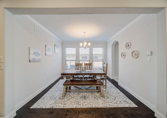 dining area with arched walkways, ornamental molding, visible vents, and baseboards