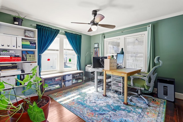 office space featuring ornamental molding, a healthy amount of sunlight, ceiling fan, and wood finished floors