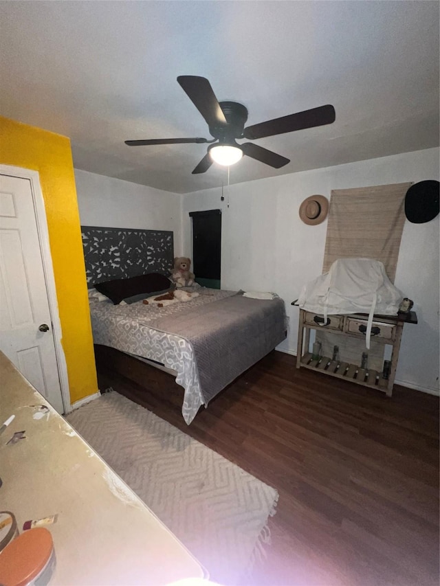 bedroom featuring ceiling fan and wood finished floors