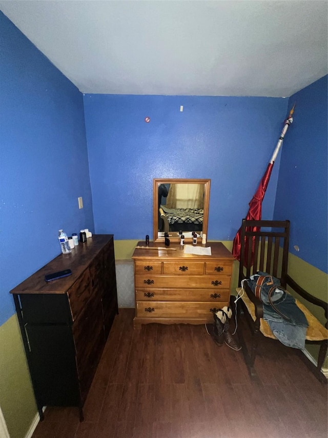 bedroom featuring dark wood-style floors