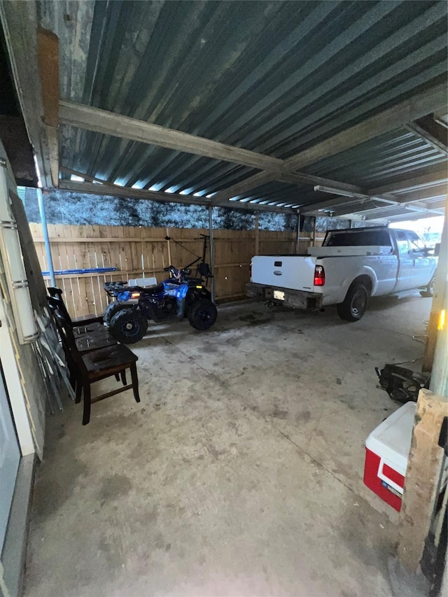 exterior space featuring fence and a carport