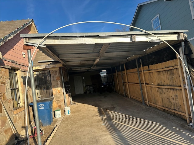 view of parking / parking lot with an attached carport