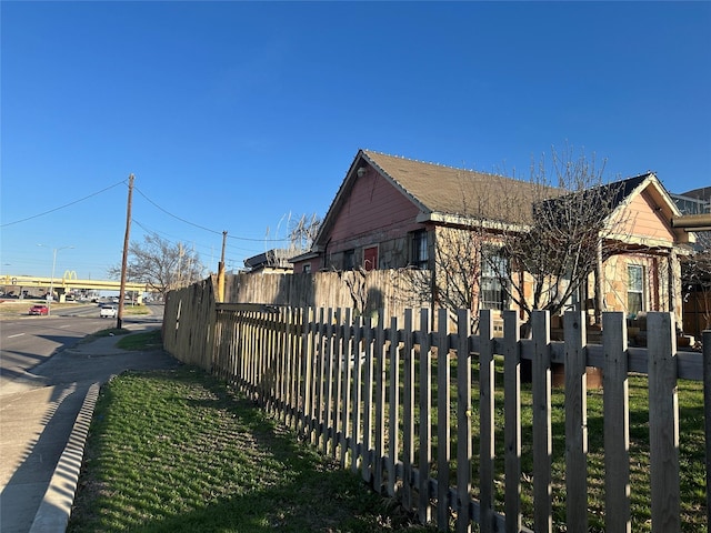 view of side of property with fence