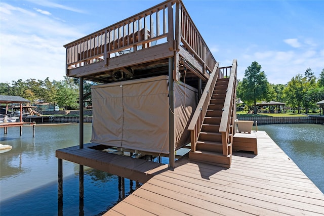 dock area featuring a water view and stairway