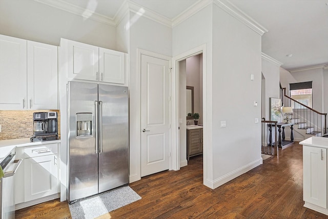 kitchen featuring dark wood-style floors, white cabinetry, light countertops, and stainless steel fridge with ice dispenser