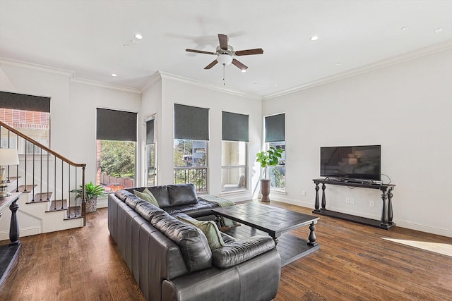 living area with ornamental molding, dark wood-style flooring, stairway, and baseboards