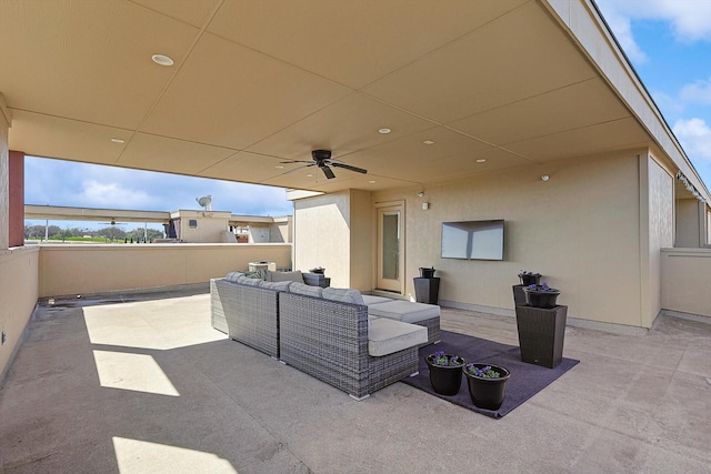 view of patio with ceiling fan and an outdoor hangout area