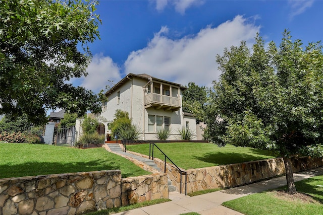 exterior space with fence and a yard