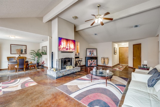 living room featuring beam ceiling, a fireplace, visible vents, and baseboards