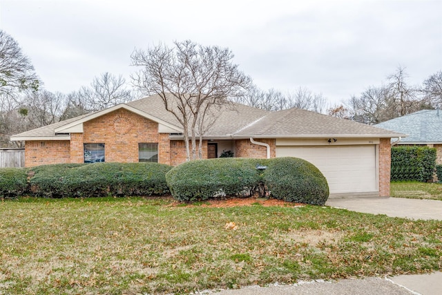 ranch-style house featuring brick siding, an attached garage, driveway, and a front lawn