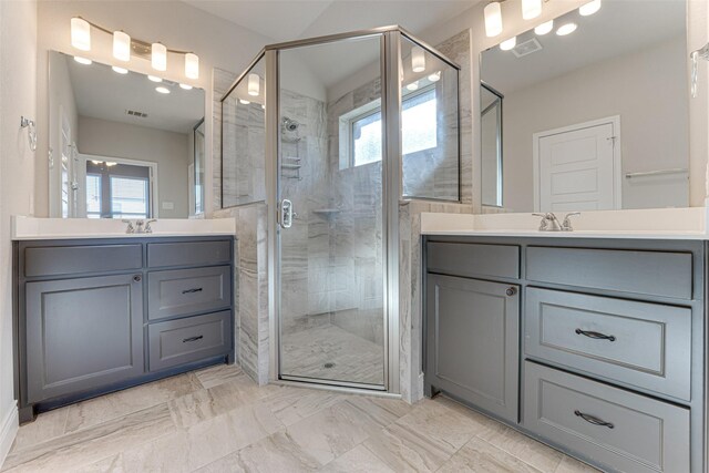 bathroom with vaulted ceiling, ceiling fan, vanity, and baseboards