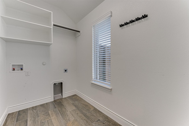 washroom with washer hookup, hookup for a gas dryer, hookup for an electric dryer, wood finished floors, and laundry area