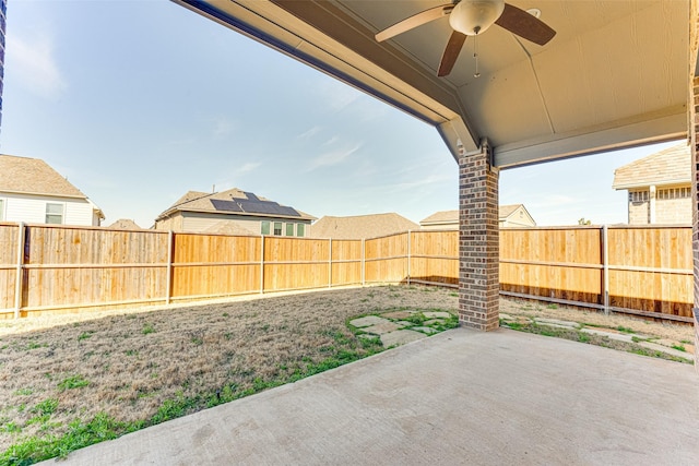 view of patio with a fenced backyard and ceiling fan