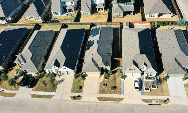 birds eye view of property with a residential view