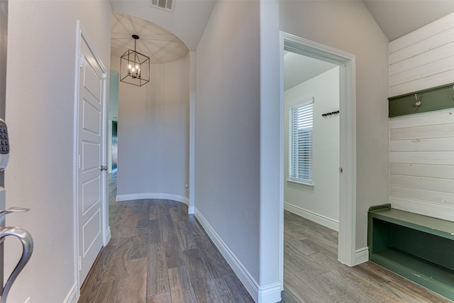 unfurnished living room featuring visible vents, wood finished floors, a wealth of natural light, and a ceiling fan