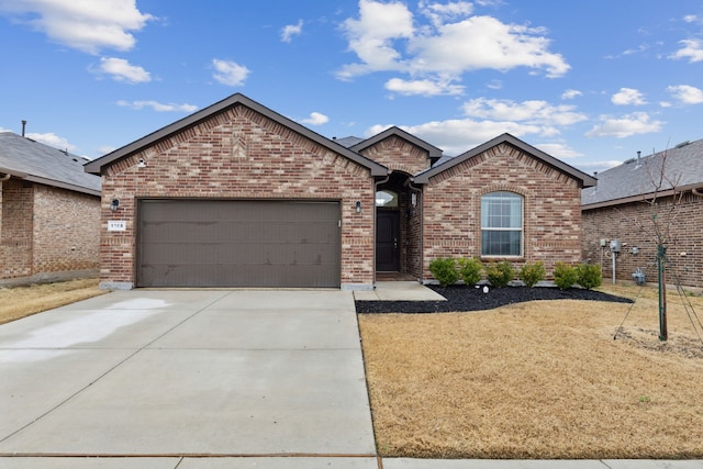 ranch-style home featuring an attached garage, concrete driveway, and brick siding