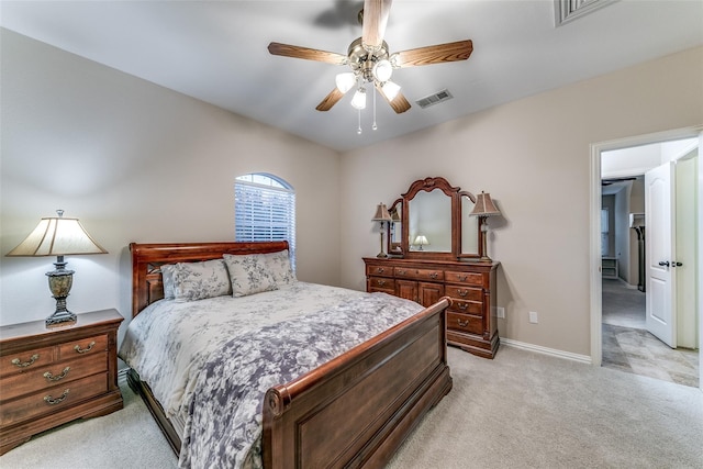 bedroom featuring baseboards, ceiling fan, visible vents, and light colored carpet