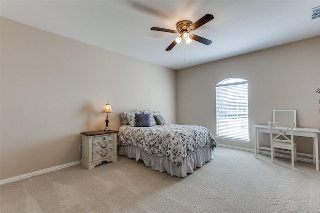 bedroom featuring light carpet, ceiling fan, visible vents, and baseboards