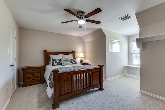 carpeted bedroom with a ceiling fan, visible vents, and baseboards