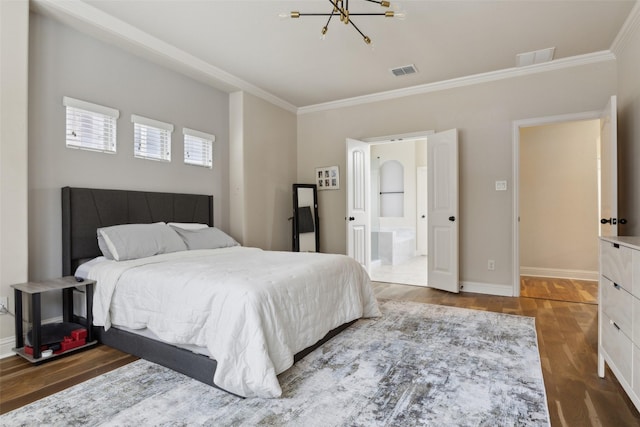 bedroom featuring visible vents, baseboards, dark wood finished floors, and ornamental molding