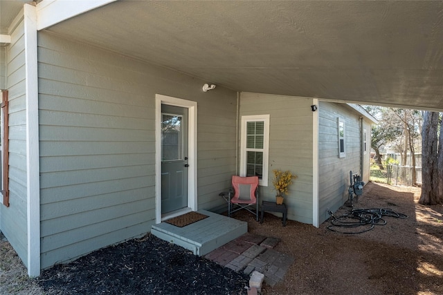 property entrance with fence