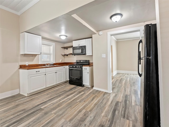 kitchen featuring ornamental molding, white cabinets, black appliances, and open shelves